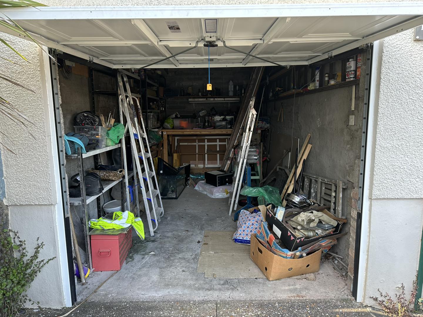 a garage with a lot of tools and objects in Neath, Port Talbot, and Swansea
