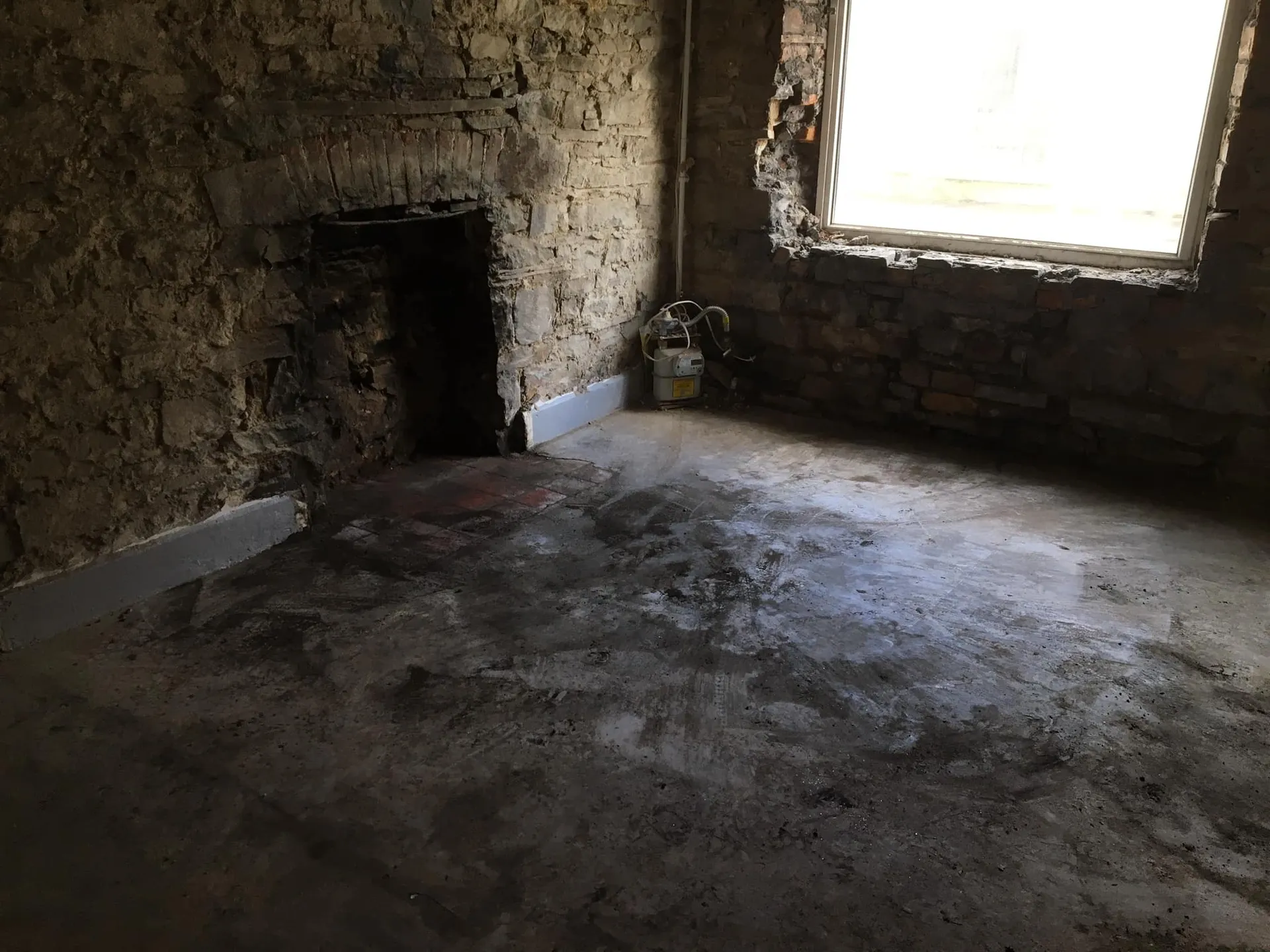 a photo of a fireplace and empty room in Neath, Port Talbot, And Swansea
