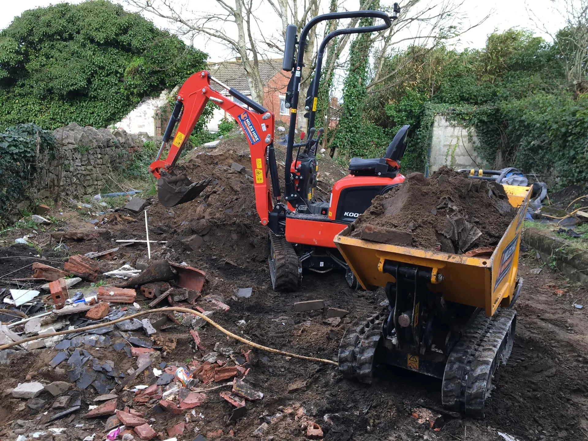 a photo of machinery at work by rubble in Neath, Port Talbot, And Swansea