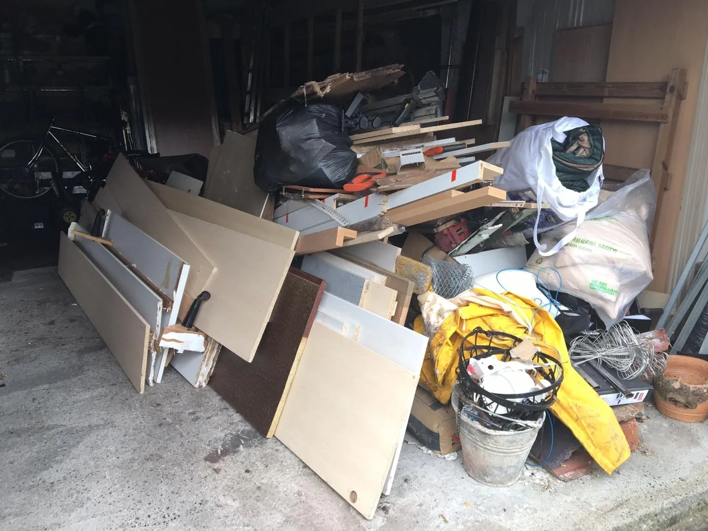 a pile of wood and plastic in a garage in Neath, Port Talbot, and Swansea