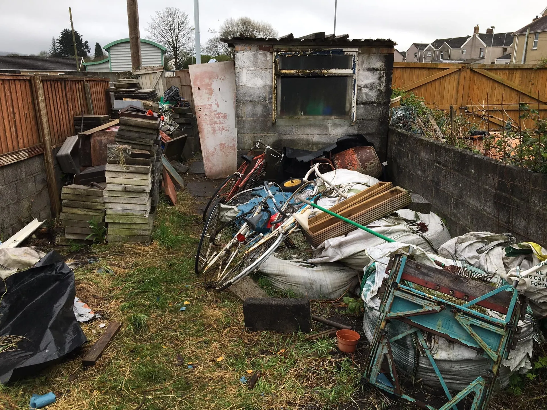 a photo of a garden full of junk in Neath, Port Talbot, and Swansea