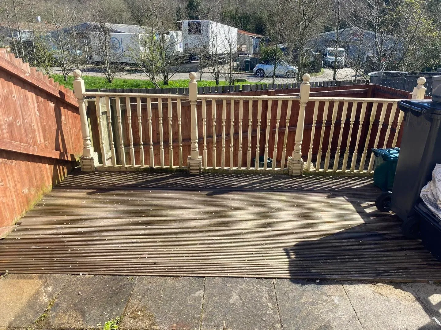 a clear photo of a garden with wooden decking in Neath, Port Talbot, and Swansea