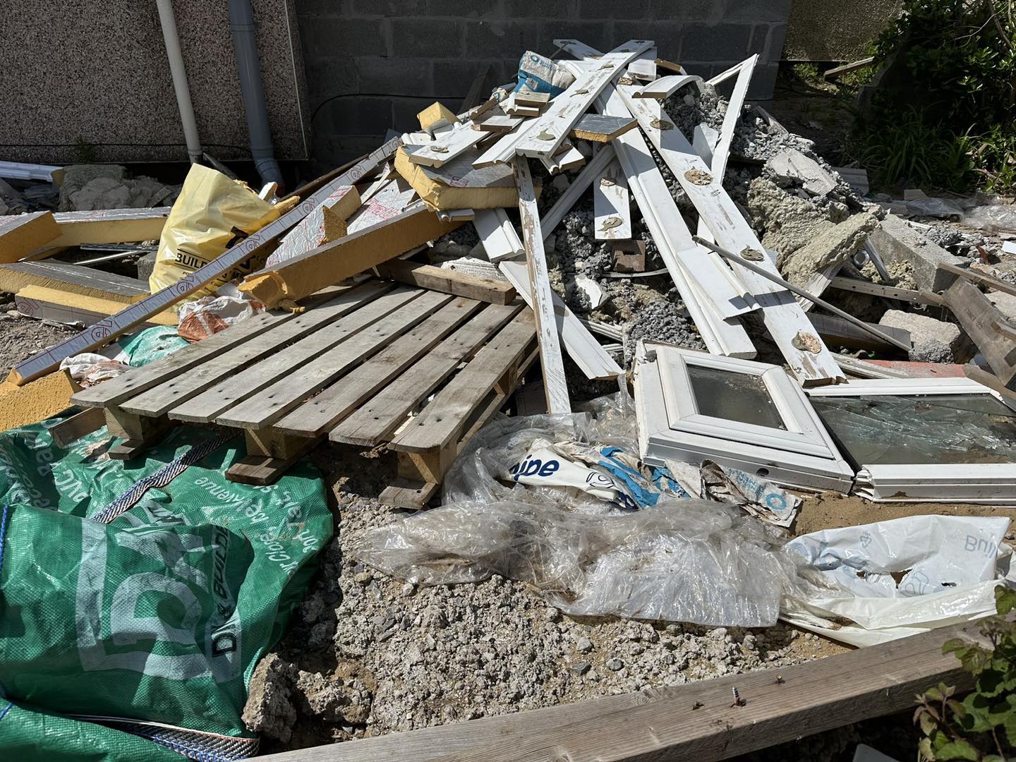 a photo of junk in a garden in Neath, Port Talbot, And Swansea