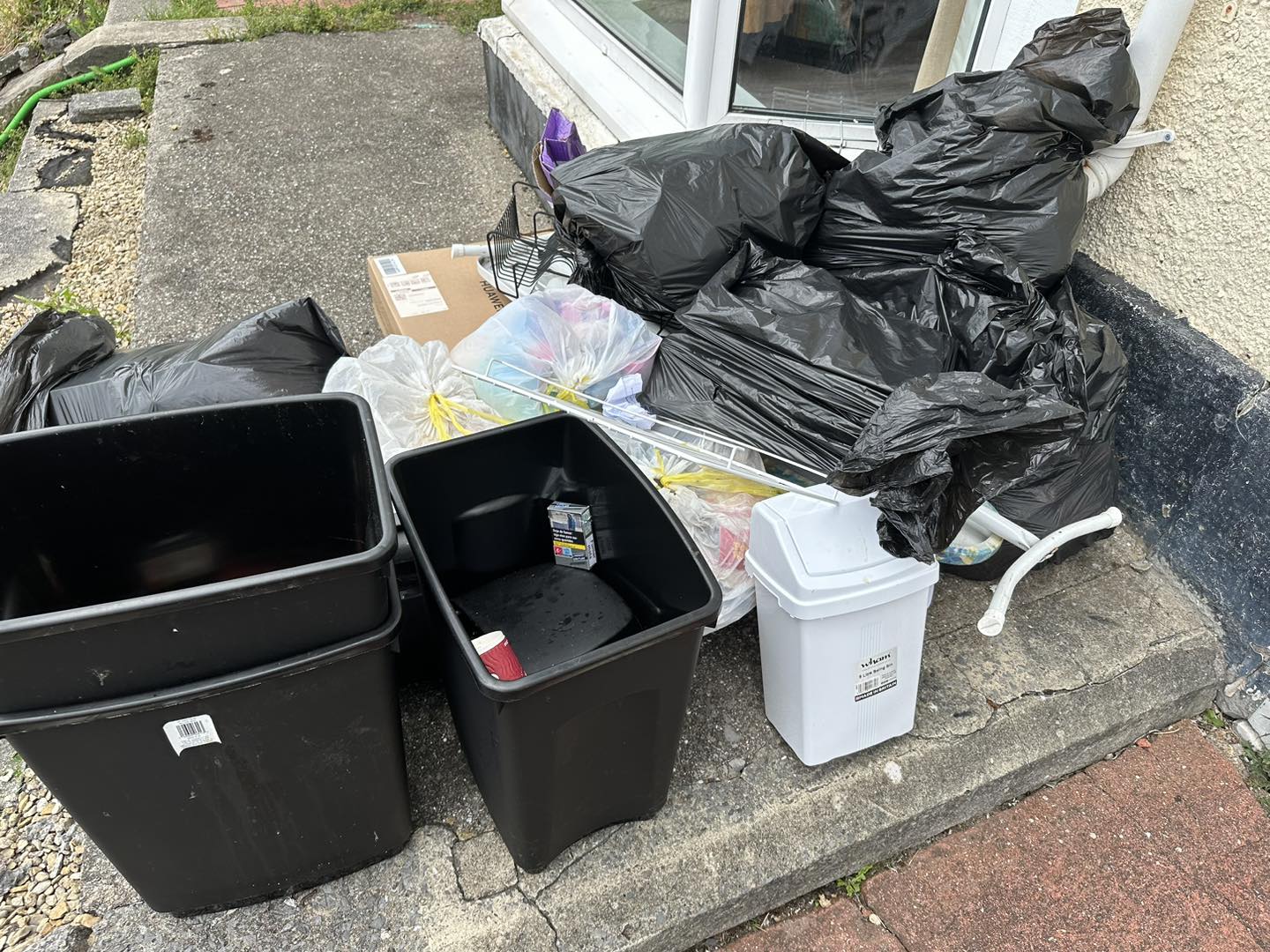 a photo of plastic tubs and black bags in Neath, Port Talbot, And Swansea