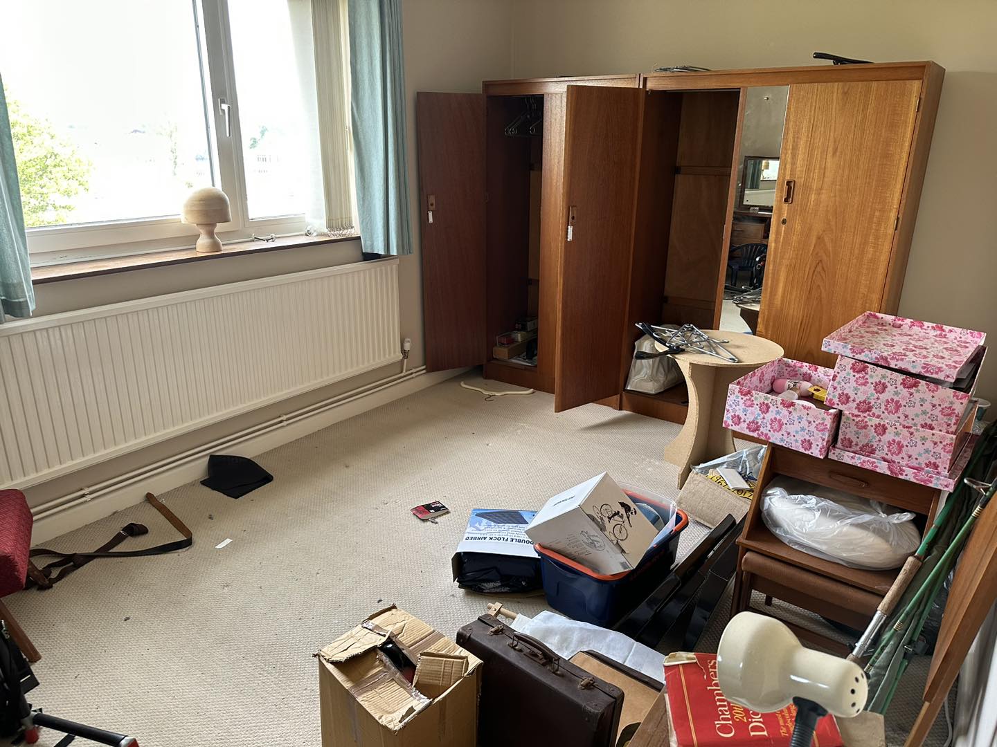 A photo of a large bedroom full of waste