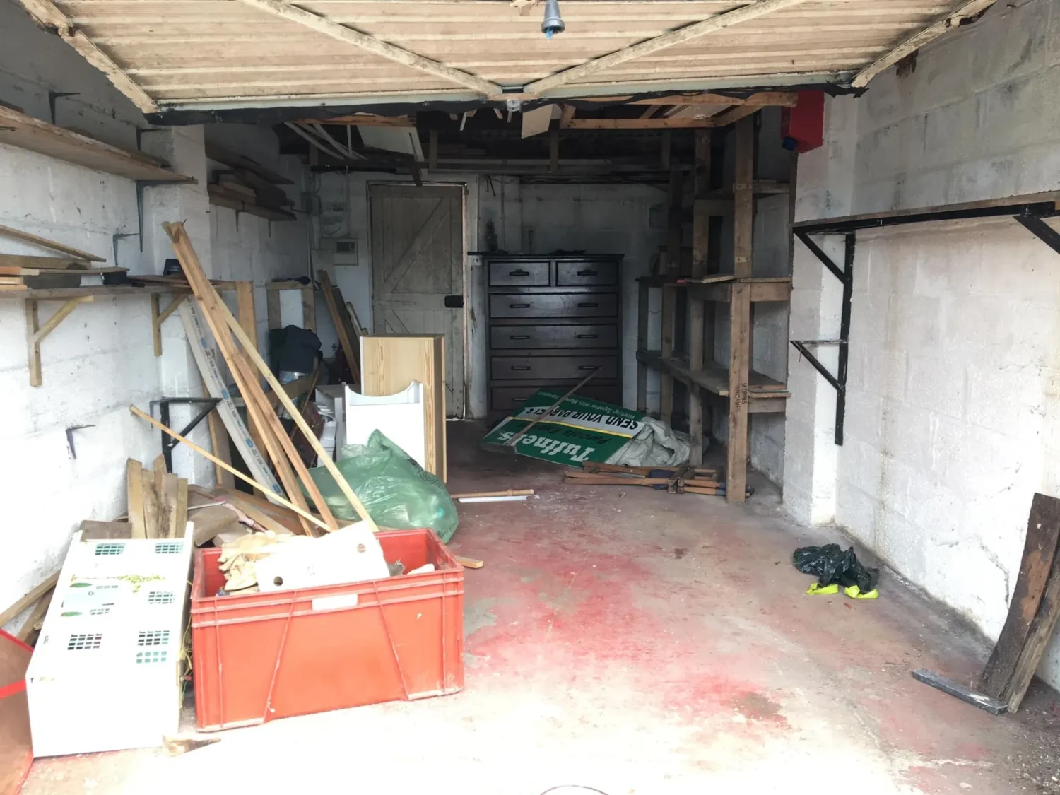 A photo of a garage with junk