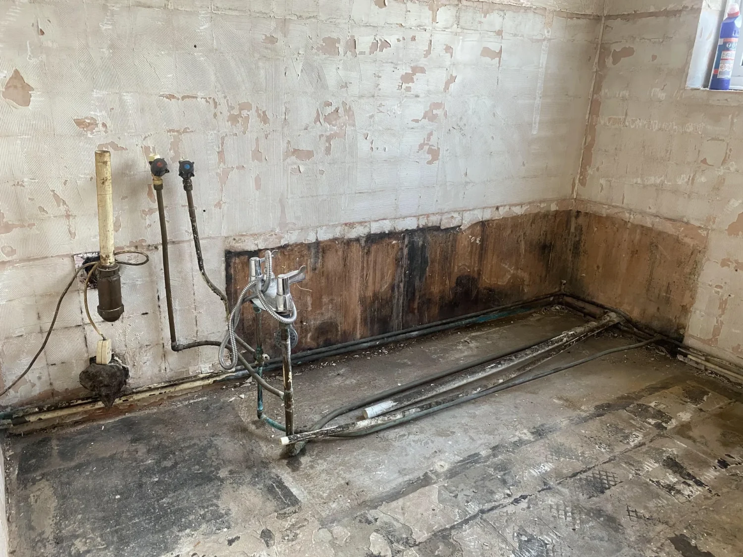 A photo of a bathroom that has been removed and stripped out