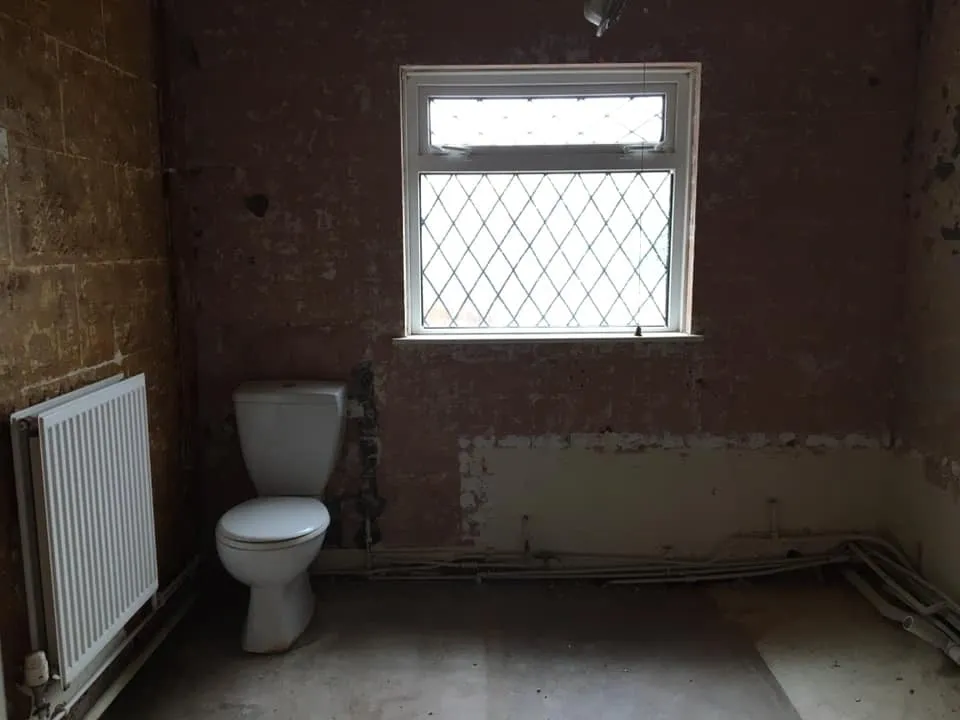 A photo of a bathroom that has been removed and stripped out